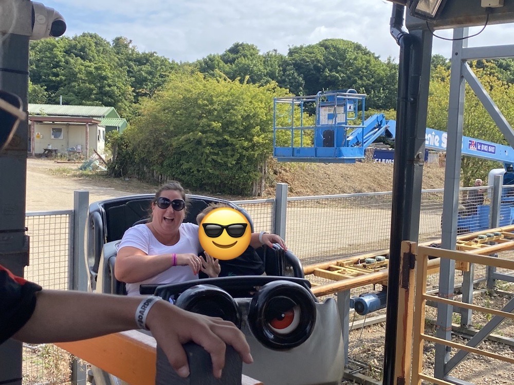 Laura and E wave from their car!
