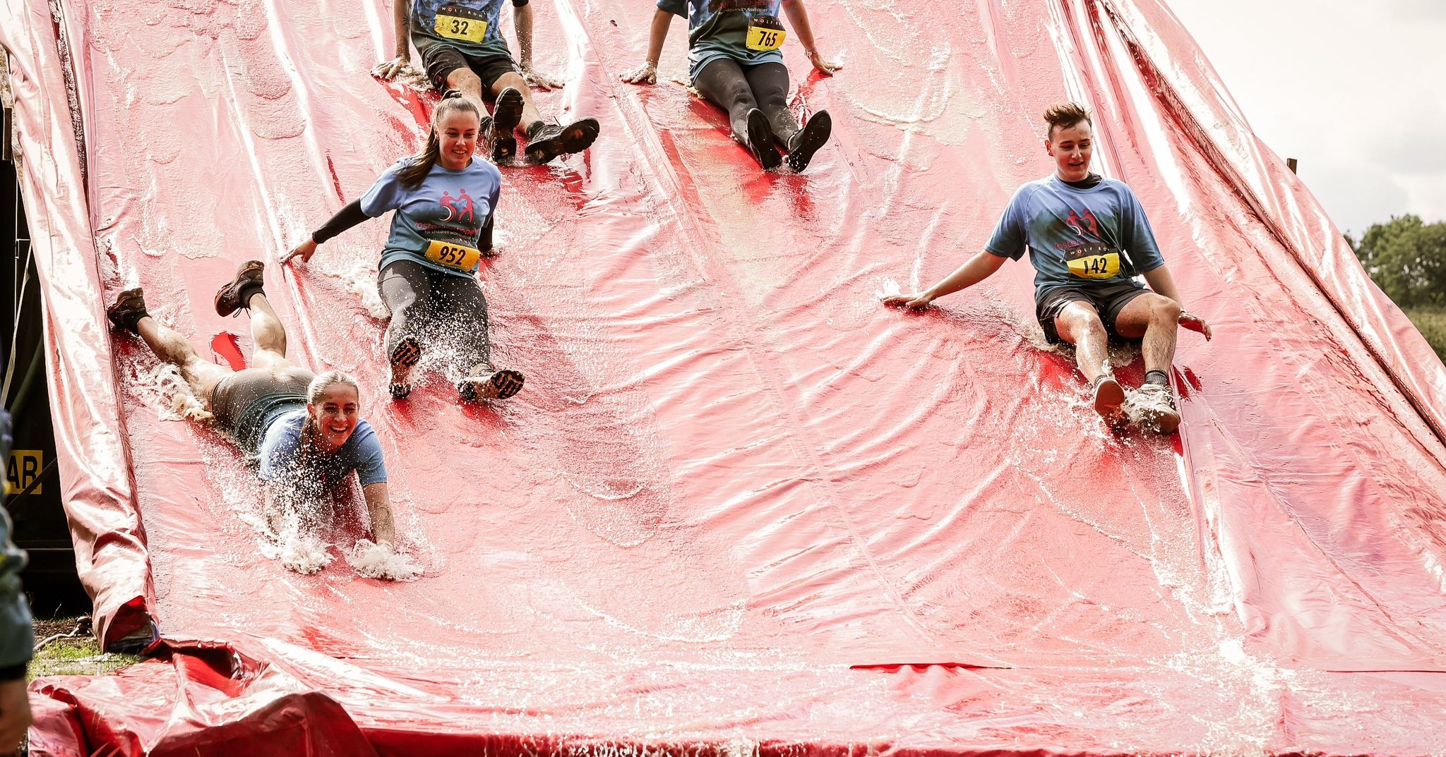 Down the slide into the mud!