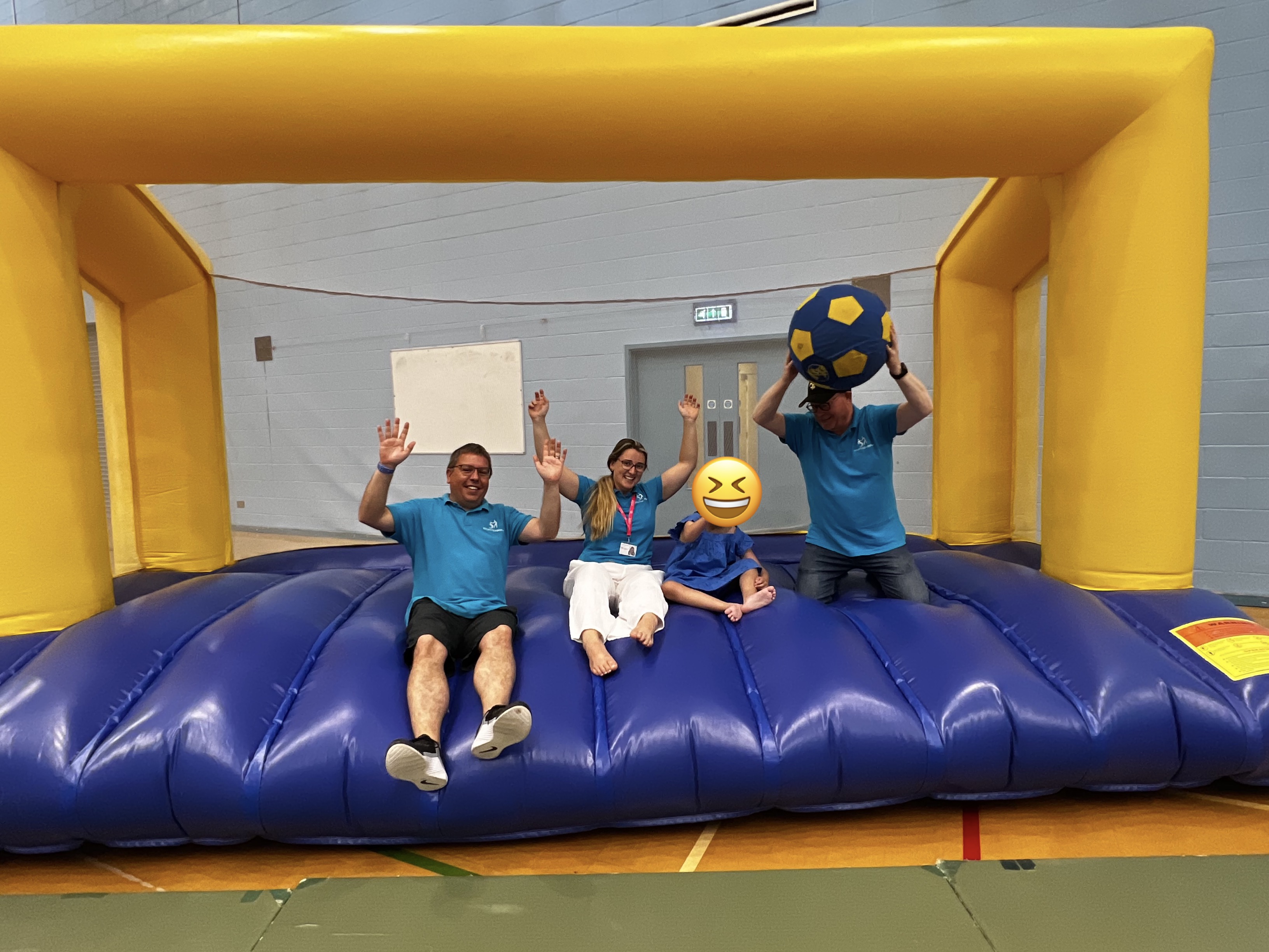 The Fostering Together team on the bouncy castle