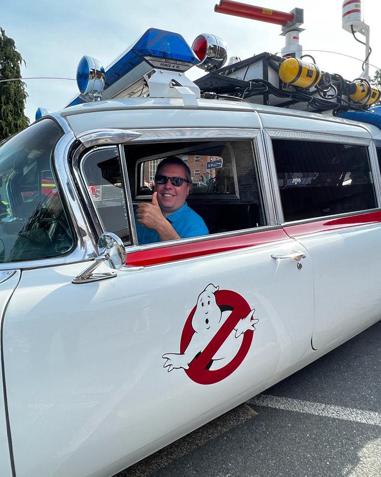 Matt posing in the Ecto-1 car from Ghostbusters!